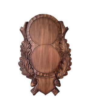 Carved double boar trophy shield made of oak